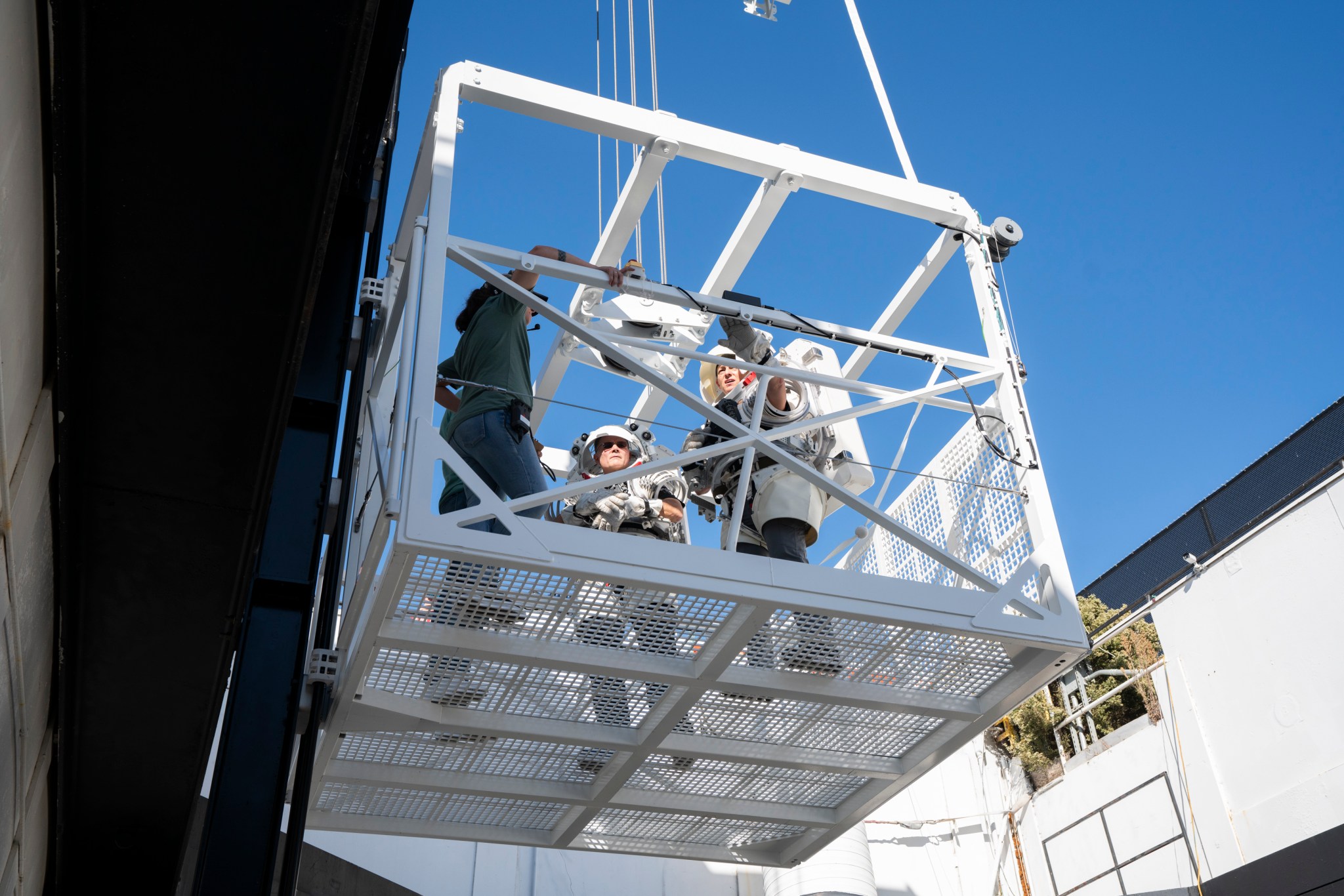 NASA astronauts Nicole Mann and Doug “Wheels” Wheelock participated in a recent test of a sub-scale mockup elevator for SpaceX’s Starship human landing system that will be used for NASA’s Artemis III and IV missions to the Moon.