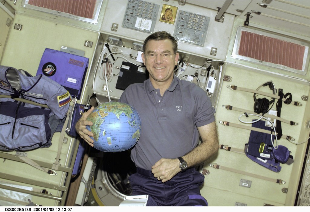 Astronaut James S. Voss, Expedition Two flight engineer, holds a globe to be used for assistance in Earth observation duties. Voss is in the Zvezda Service Module aboard the International Space Station (ISS), where he's been working for several weeks along with cosmonaut Yury V. Usachev of Rosaviakosmos and astronaut Susan J. Helms. The image was recorded with a digital still camera.
