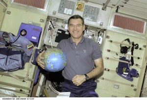 Astronaut James S. Voss, Expedition Two flight engineer, holds a globe to be used for assistance in Earth observation duties. Voss is in the Zvezda Service Module aboard the International Space Station (ISS), where he's been working for several weeks along with cosmonaut Yury V. Usachev of Rosaviakosmos and astronaut Susan J. Helms. The image was recorded with a digital still camera.