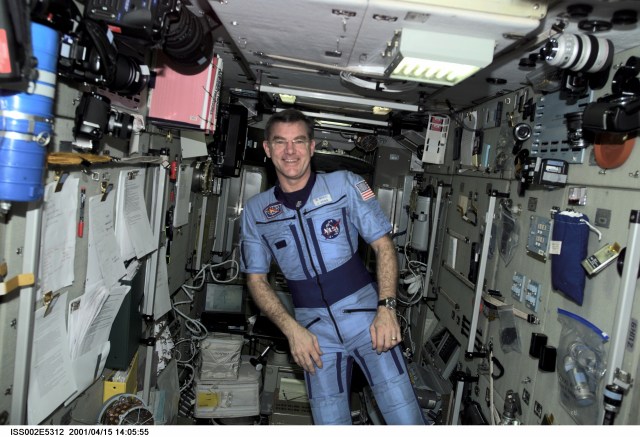 Astronaut James S. Voss, Expedition Two flight engineer, poses in his Russian flight suit in the Zarya / Functional Cargo Block (FGB) module of the International Space Station (ISS). This image was recorded with a digital still camera.