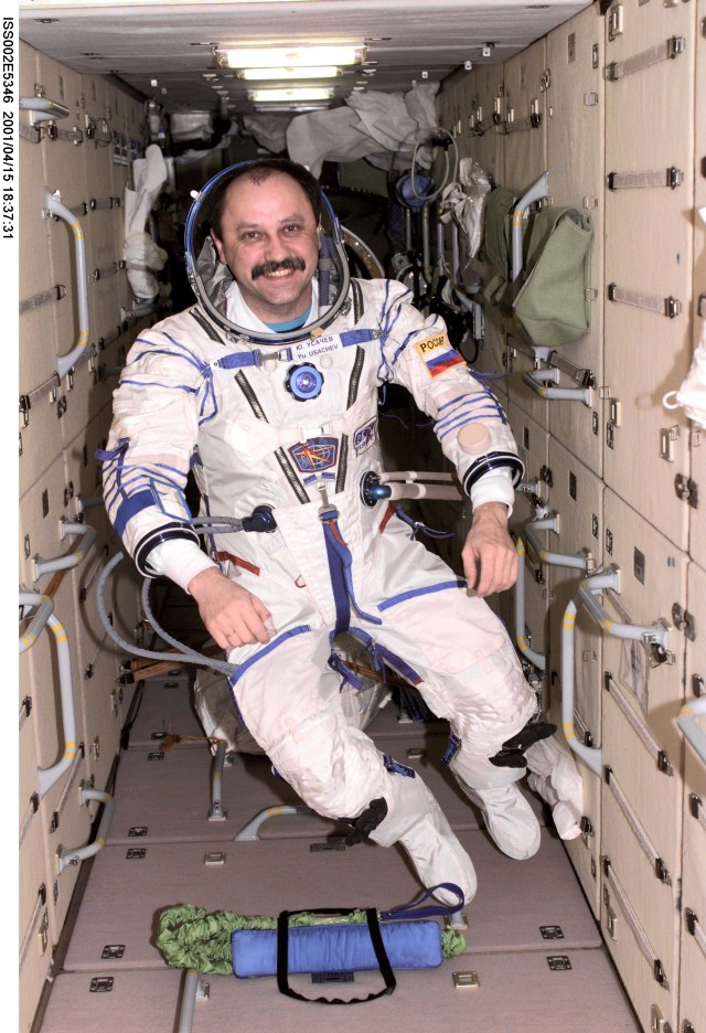 Cosmonaut Yury V. Usachev, Expedition Two mission commander, dons a Russian Sokol suit in the Zarya Functional Cargo Block (FGB) of the International Space Station (ISS). This image was recorded with a digital still camera.