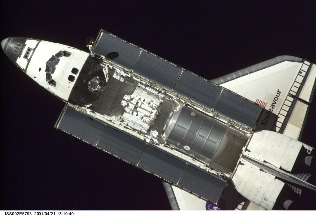 The Space Shuttle Endeavour, with six astronauts and a cosmonaut onboard, approaches the International Space Station (ISS) for an April 21 docking. The photo was taken with a digital still camera by one of the three Expedition Two crew members onboard the Station.