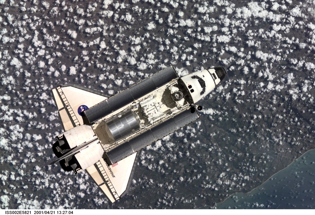 The Space Shuttle Endeavour, with six astronauts and a cosmonaut onboard, approaches the International Space Station (ISS) for an April 21 docking. The photo was taken with a digital still camera by one of the three Expedition Two crew members onboard the Station.