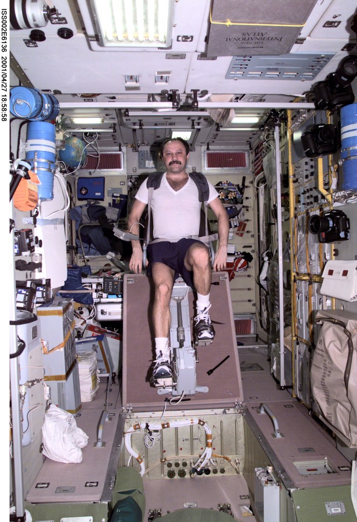 Yury V. Usachev of Rosaviakosmos, Expedition Two mission commander, exercises on the cycle ergometer in the Zvezda Service Module. The image was taken with a digital still camera.