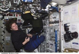 Susan J. Helms, Expedition Two flight engineer, works with three laptop computers at the Human Research Facility (HRF) in the U.S. Laboratory. The image was taken with a digital still camera.