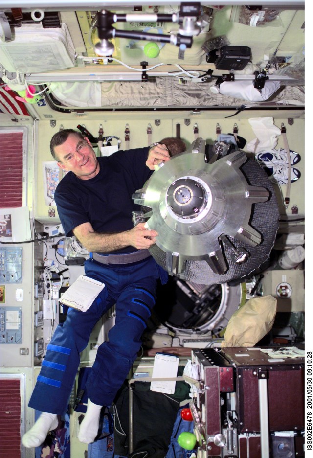 James S. Voss, Expedition Two flight engineer, handles a spacecraft docking probe in the Service Module. The docking probe assists with the docking of the Soyuz and Progress vehicles to the International Space Station. The image was taken with a digital still camera.