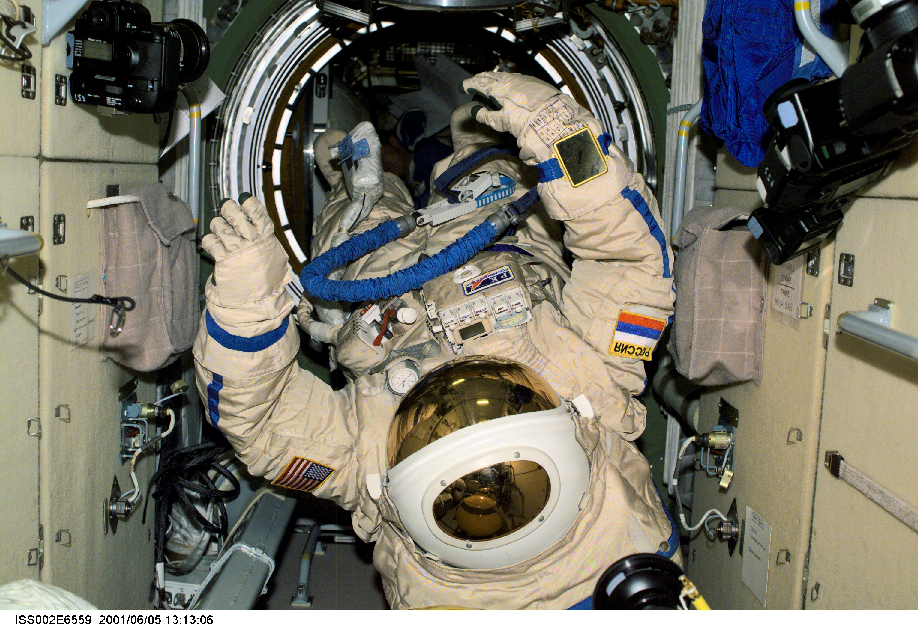 View of Russian Orlan space suits drifting in the Zarya module of the International Space Station (ISS). These Orlan spacesuits were used by Yury V. Usachev of Rosaviakosmos, Expedition Two mission commander, and James S. Voss, Expedition Two flight engineer, for their June 8, 2001, space walk. The image was recorded with a digital still camera.