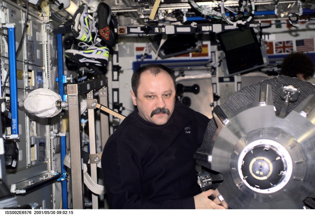 Yury V. Usachev of Rosaviakosmos, Expedition Two mission commander, moves a docking probe through the Destiny Laboratory on the International Space Station (ISS). The image was recorded with a digital still camera.