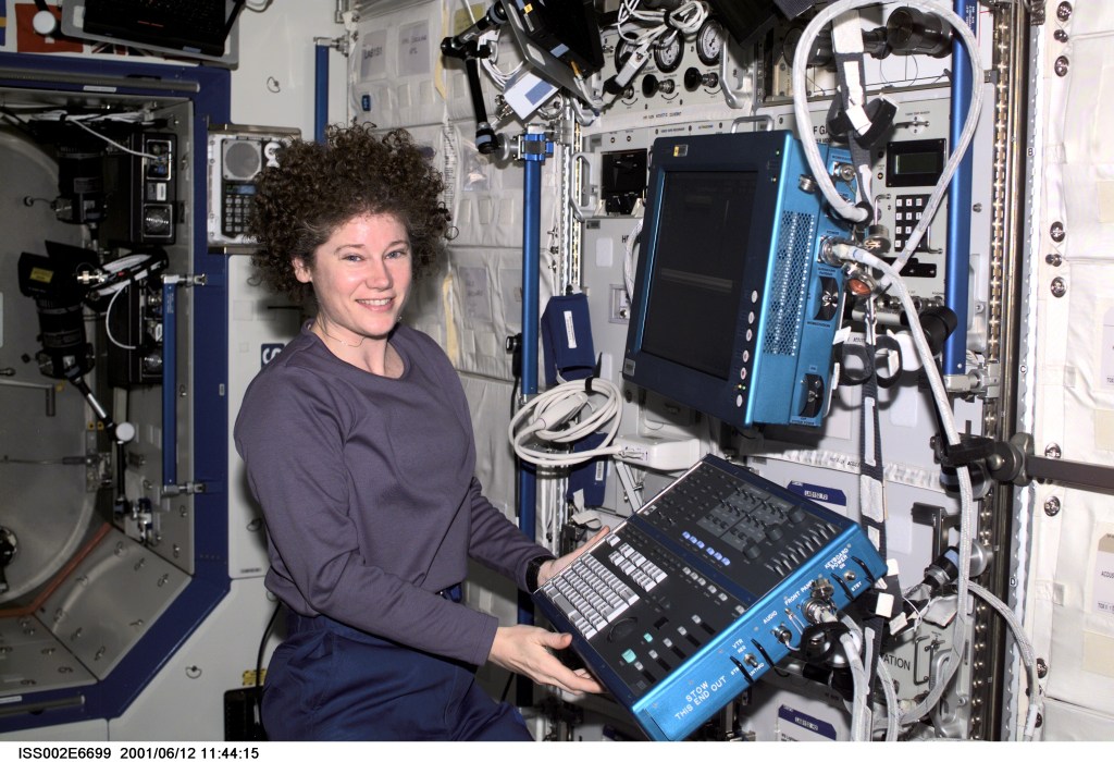 Astronaut Susan J. Helms, Expedition Two flight engineer, works at the Human Research Facility's (HRF) Ultrasound Flat Screen Display and Keyboard Module in the Destiny/U.S. Laboratory. A digital still camera was used to record this image.