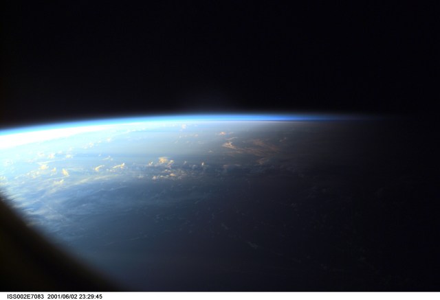Earth's limb at sunset as photographed by one of the Expedition Two crew members with a digital still camera aimed through the nadir window of the U.S. laboratory Destiny.
