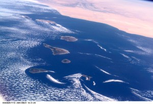 Commonly visible cloud vortices hover in the area of the Canary Islands off the coast of Morocco in this Expedition Two digital still camera's view from the International Space Station (ISS).