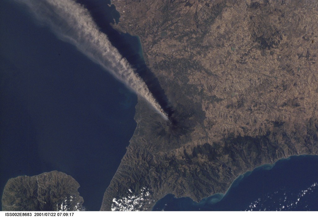 Smoke and ash combine to create a plume extending from the erupting volcano on Mt. Etna in Sicily. The digital still image was recorded by one of the Expedition Two crew members.