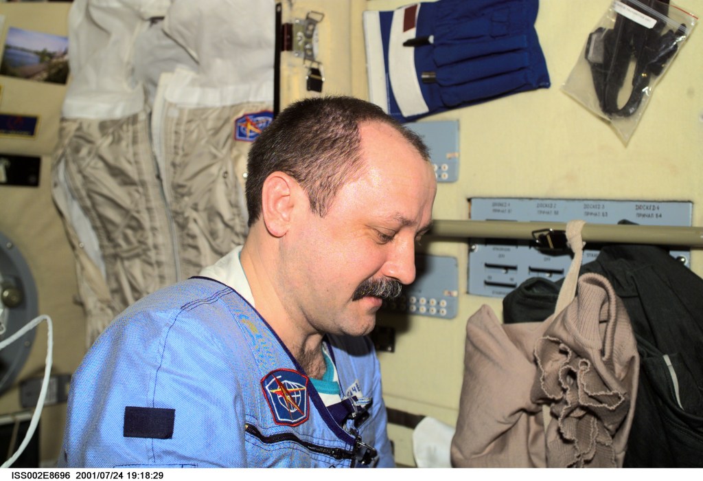 ISS002-E-8696 (24 July 2001) --- Cosmonaut Yury V. Usachev of Rosaviakosmos, Expedition Two commander, was photographed in the Zvezda Service Module with a digital still camera. Usachev and two NASA astronauts are in the last few weeks of a lengthy stay aboard the International Space Station (ISS).