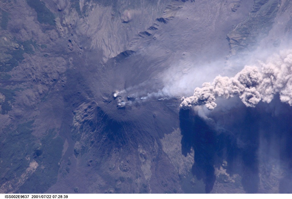 An overhead look at the smoke and ash being expelled from the erupting volcano Mt. Etna on the island of Sicily. This image was recorded by an Expedition Two crew member with a digital still camera.