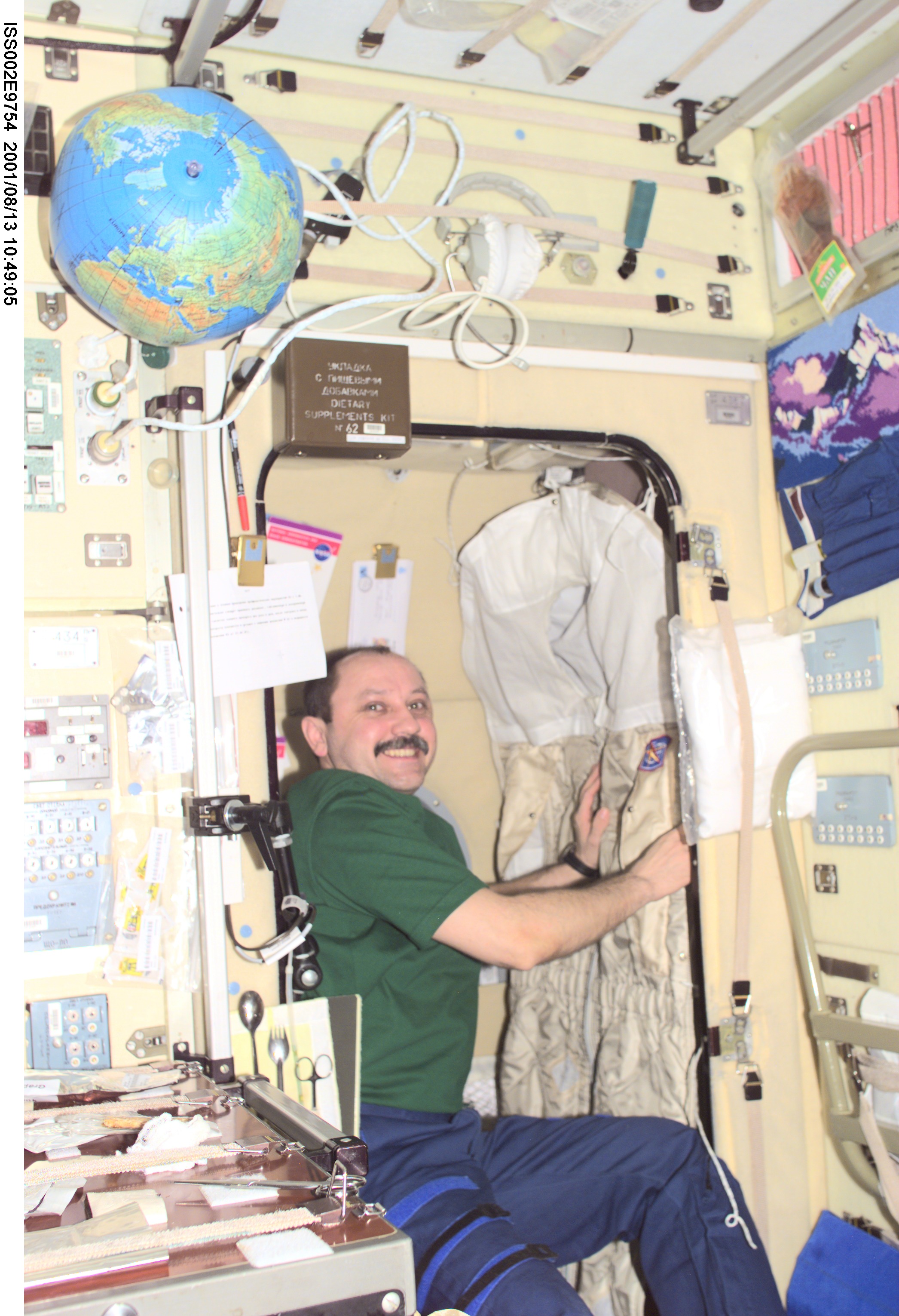 In preparation for his return to Earth, Yury V. Usachev of Rosaviakosmos, Expedition Two mission commander, packs his belongings in the Zvezda Service Module. Usachev and fellow crewmates Susan J. Helms and James S. Voss will be replaced aboard the International Space Station (ISS) by the Expedition Three crew which includes Frank L. Culbertson, Jr., mission commander, and cosmonauts Vladimir N. Dezhurov and Mikhail Tyurin, flight engineers. This image was taken with a digital still camera.
