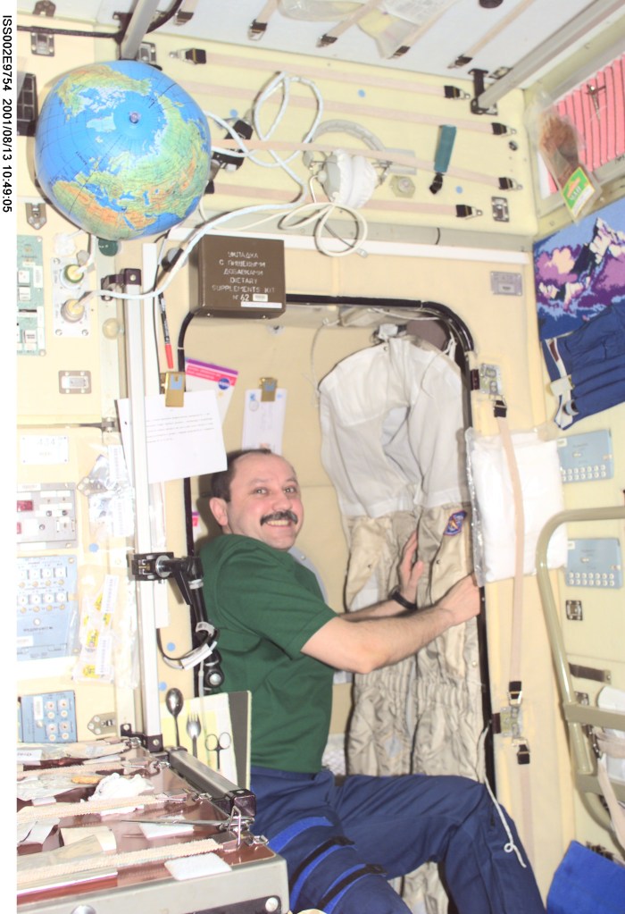 In preparation for his return to Earth, Yury V. Usachev of Rosaviakosmos, Expedition Two mission commander, packs his belongings in the Zvezda Service Module. Usachev and fellow crewmates Susan J. Helms and James S. Voss will be replaced aboard the International Space Station (ISS) by the Expedition Three crew which includes Frank L. Culbertson, Jr., mission commander, and cosmonauts Vladimir N. Dezhurov and Mikhail Tyurin, flight engineers. This image was taken with a digital still camera.