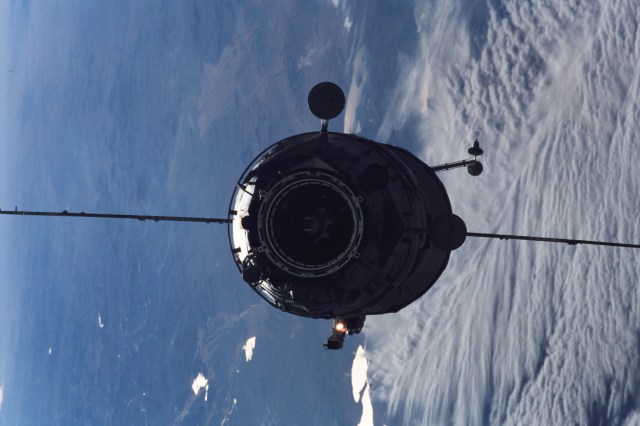 The Russian Docking Compartment named Pirs, the Russian word for pier, approaches the International Space Station (ISS). The Pirs will provide a docking port for future Russian spacecraft as well as an airlock for extravehicular activities (EVA).