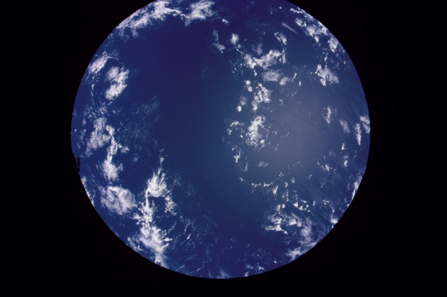 ISS003-319-035 (20 November 2001) --- A partial Earth with clouds, framed by a circular window on the International Space Station (ISS), was photographed by one of the crew members on the orbital outpost.