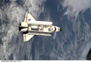 The Space Shuttle Discovery approaches the International Space Station (ISS) during the STS-105 mission. Aboard Discovery are the members of the Expedition Three crew -- Frank L. Culbertson, mission commander, and cosmonauts Vladimir N. Dezhurov and Mikhail Tyurin, flight engineers -- who will be replacing the Expedition Two crew that has been living on the ISS for the past five months. This image was taken by an Expedition Two crew member with a digital still camera.