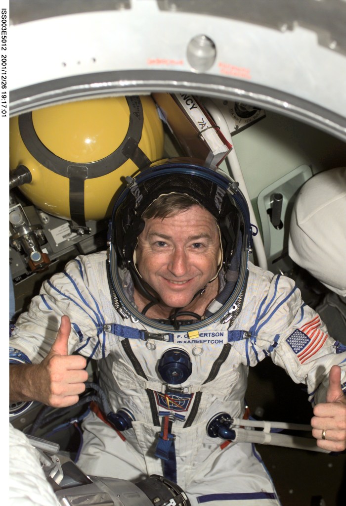 Astronaut Frank L. Culbertson, Jr., Expedition Three mission commander, wearing a Russian Sokol suit, is seated in the Soyuz spacecraft that is docked to the International Space Station (ISS). Culbertson and two cosmonauts , who came up to the orbital outpost onboard the Space Shuttle Discovery with the crew of the STS-105 mission, will be replacing astronauts Susan J. Helms and James S. Voss and cosmonaut Yury V. Usachev as residents on the ISS. His Expedition Three crew mates are cosmonauts Vladimir N. Dezhurov and Mikhail Tyurin, flight engineers. This image was taken with a digital still camera.