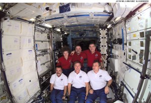 The Expedition Two (back row) and Expedition Three crews assemble for a group photo in the Destiny laboratory on the International Space Station (ISS). The Expedition Two crew members are, from left to right, Susan J. Helms, flight engineer, cosmonaut Yury V. Usachev, mission commander, and James S. Voss, flight engineer. The Expedition Three crew members are, from left to right, cosmonaut Mikhail Tyurin, flight engineer, Frank L. Culbertson, Jr., mission commander, and cosmonaut Vladimir N. Dezhurov, flight engineer. Dezhurov, Tyurin and Usachev represent Rosaviakosmos. This image was taken with a digital still camera.