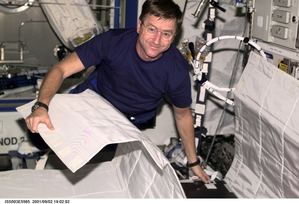 Astronaut Frank L. Culbertson, Jr., Expedition Three mission commander, assembles the Temporary Sleep Station (TESS) in the U.S. Laboratory.