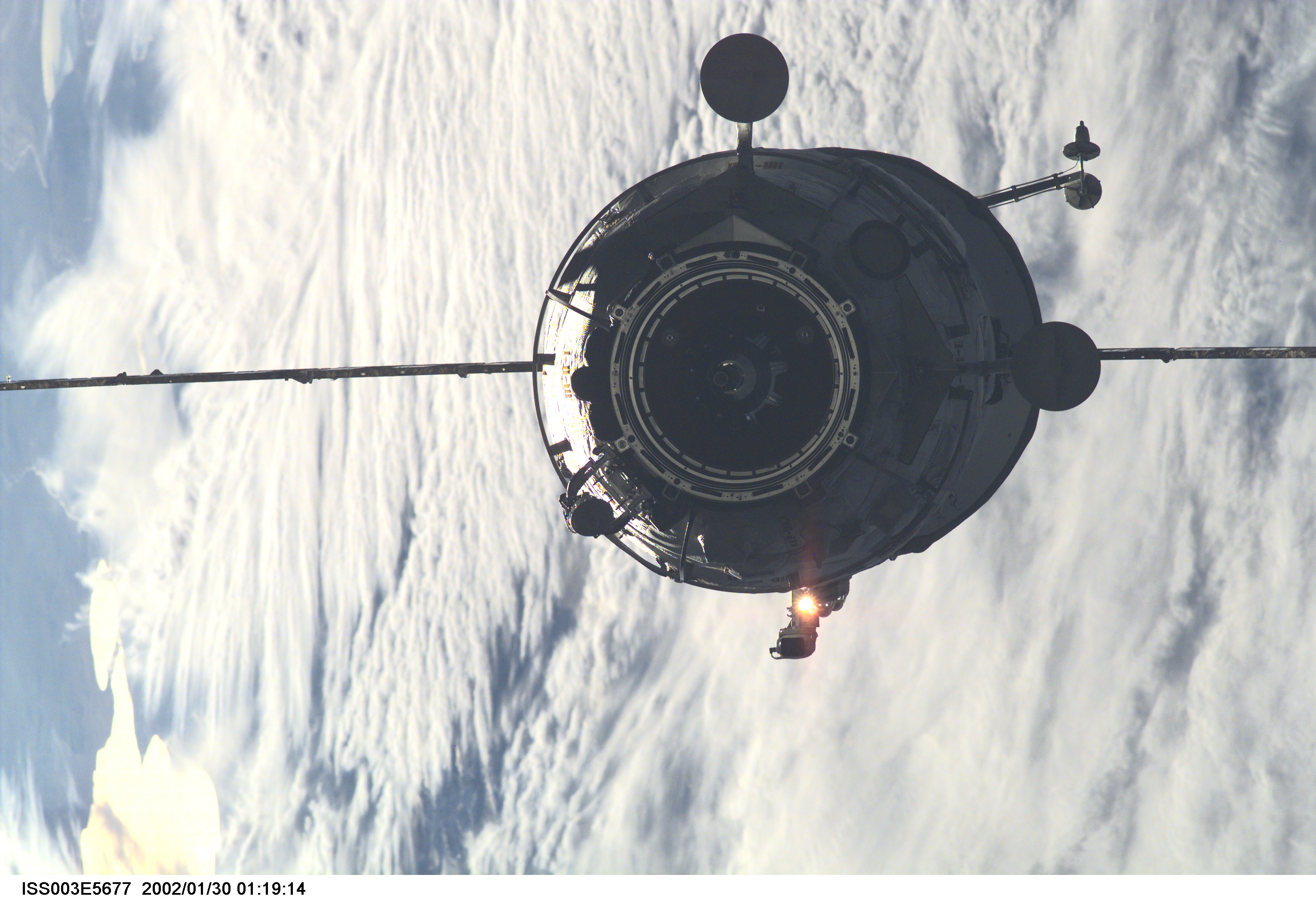 The Russian Docking Compartment, named Pirs, the Russian word for pier, approaches the International Space Station (ISS). One of the Expedition Three crew members, using a digital still camera with a 180mm lens, recorded the image from onboard the orbital outpost. The vehicle was launched on September 14, 2001 and docking occurred on September 16.