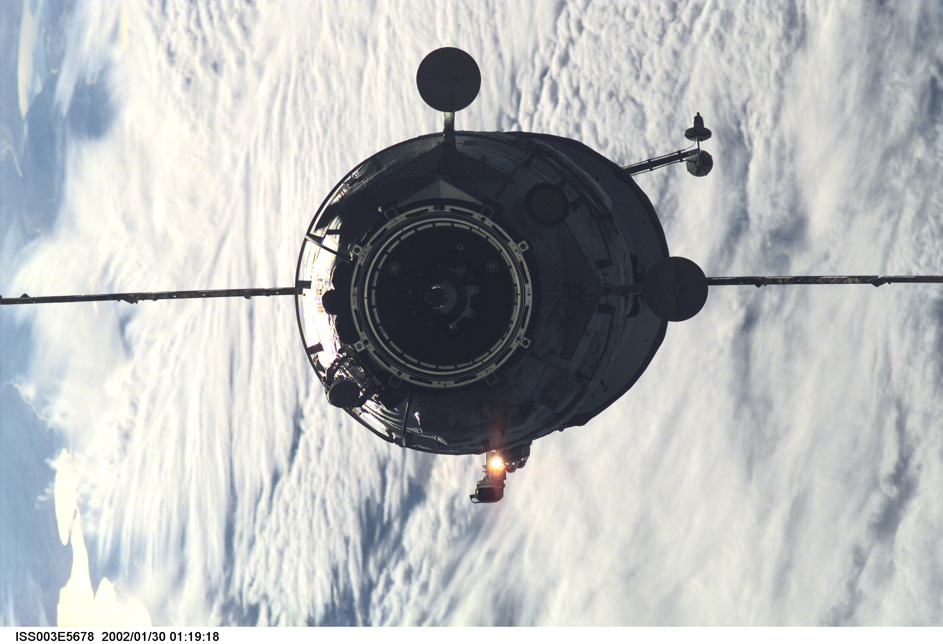 The Russian Docking Compartment, named Pirs, the Russian word for pier, approaches the International Space Station (ISS). One of the Expedition Three crew members, using a digital still camera with a 180mm lens, recorded the image from onboard the orbital outpost. The vehicle was launched on September 14, 2001 and docking occurred on September 16.