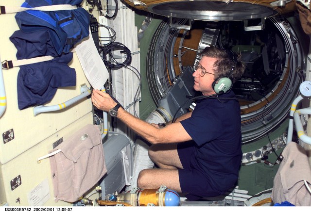 Astronaut Frank L. Culbertson, Jr., Expedition Three mission commander, operates the amateur radio equipment in the Zarya or functional cargo block (FGB) of the International Space Station (ISS). This image was taken with a digital still camera. Please note: The date identifiers on some frames are not accurate due to a technical problem with one of the Expedition Three cameras. When a specific date is given in the text or description portion, it is correct.