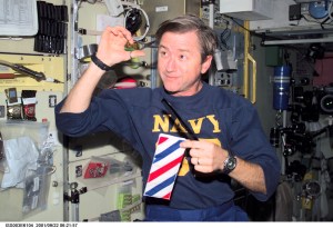 Astronaut Frank L. Culbertson, Jr., Expedition Three mission commander, cuts his hair in the Zvezda Service Module on the International Space Station (ISS). This picture was taken with a digital still camera.