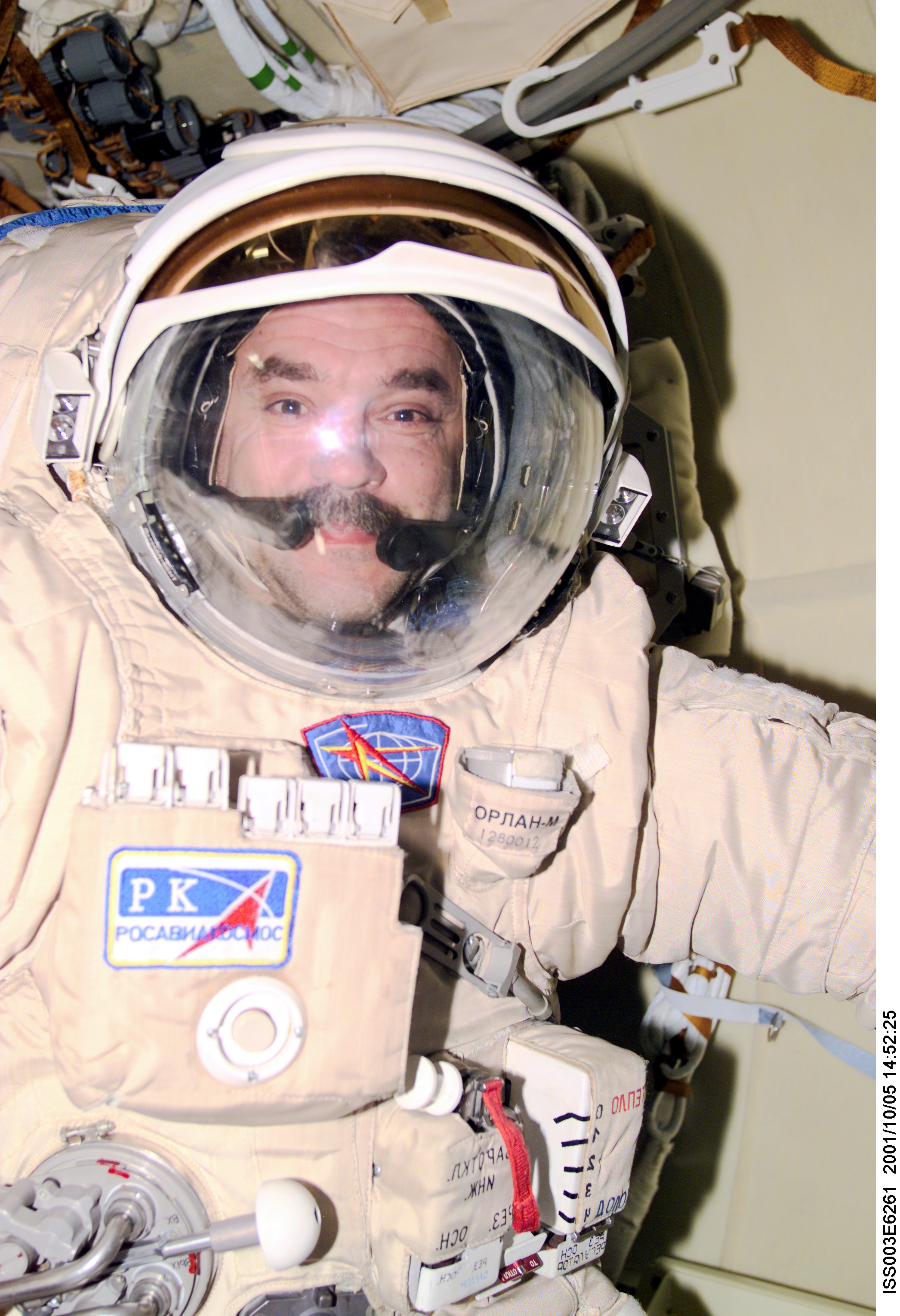 Cosmonaut Mikhail Tyurin, Expedition Three flight engineer, wears the Russian Orlan space suit as he prepares for an upcoming spacewalk from the Pirs Docking Compartment on the International Space Station (ISS). The first spacewalk is scheduled for October 8, 2001 which will be the first extravehicular activity (EVA) from the station without a Space Shuttle present. Tyurin represents Rosaviakosmos. This image was taken with a digital still camera.