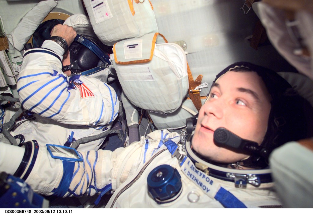 Astronaut Frank L. Culbertson (left), Expedition Three mission commander, and cosmonaut Vladimir N. Dezhurov, flight engineer, wearing Russian Sokol suits, are seated in the Soyuz spacecraft that is docked to the International Space Station (ISS). This Soyuz return vehicle will be moved from the Earth-facing port of the Zarya module for the linkup to the new Pirs Docking Compartment. The move of the Soyuz will mark the first time the new Pirs, which arrived at the station September 17, 2001, will serve as a docking port. The Soyuz will be shifted to prepare for the arrival of a new Soyuz return craft, to be launched October 21, 2001 from the Baikonur Cosmodrome in Kazakhstan. The Soyuz can serve as a crew return vehicle at the station for a maximum of about six months. Dezhurov represents Rosaviakosmos. This image was taken with a digital still camera.
