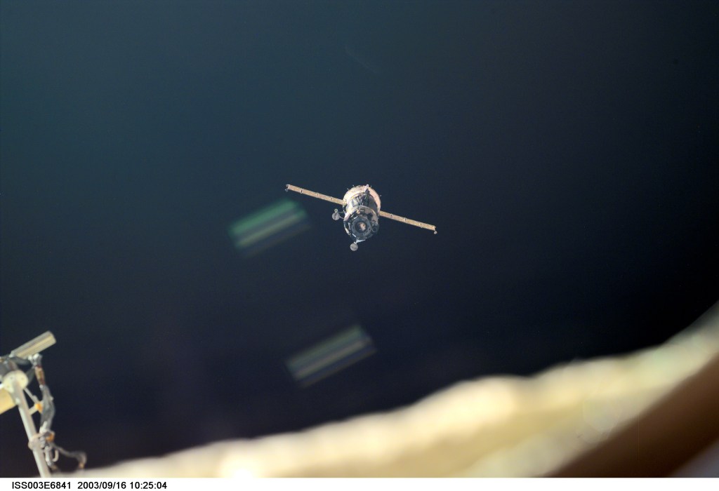 A Soyuz spacecraft approaches the International Space Station (ISS) carrying the Soyuz taxi crew, Commander Victor Afanasyev, Flight Engineer Konstantin Kozeev and French Flight Engineer Claudie Haignere for an eight-day stay on the station. Afanasyev and Kozeev represent Rosaviakosmos, and Haignere represents ESA, carrying out a flight program for CNES, the French Space Agency, under a commercial contract with the Russian Aviation and Space Agency. This image was taken with a digital still camera.