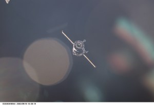 A Soyuz spacecraft approaches the International Space Station (ISS) carrying the Soyuz taxi crew, Commander Victor Afanasyev, Flight Engineer Konstantin Kozeev and French Flight Engineer Claudie Haignere for an eight-day stay on the station. Afanasyev and Kozeev represent Rosaviakosmos, and Haignere represents ESA, carrying out a flight program for CNES, the French Space Agency, under a commercial contract with the Russian Aviation and Space Agency. This image was taken with a digital still camera.