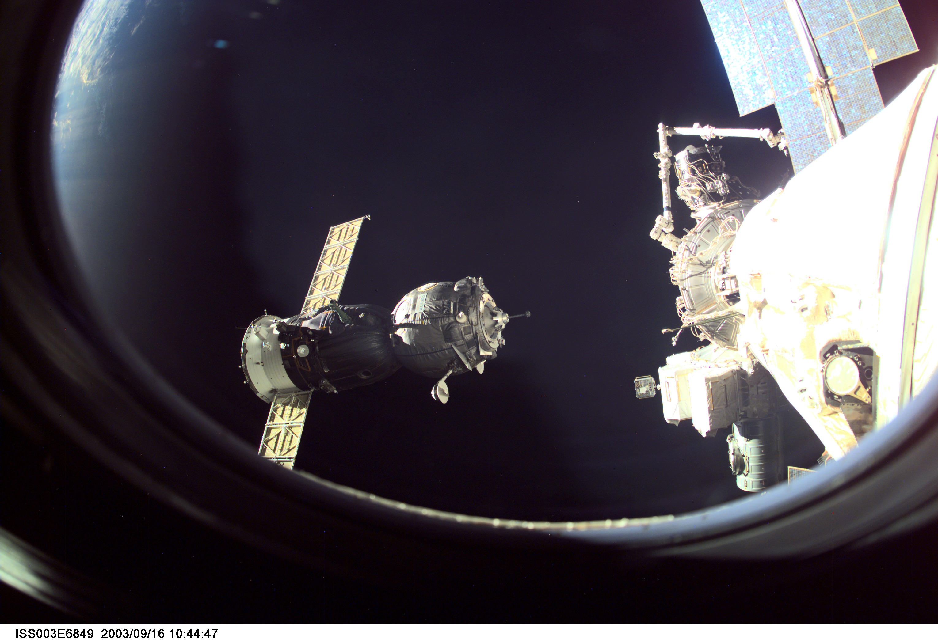 A Soyuz spacecraft approaches the International Space Station (ISS) carrying the Soyuz taxi crew, Commander Victor Afanasyev, Flight Engineer Konstantin Kozeev and French Flight Engineer Claudie Haignere for an eight-day stay on the station. Afanasyev and Kozeev represent Rosaviakosmos, and Haignere represents ESA, carrying out a flight program for CNES, the French Space Agency, under a commercial contract with the Russian Aviation and Space Agency. This image was taken with a digital still camera.