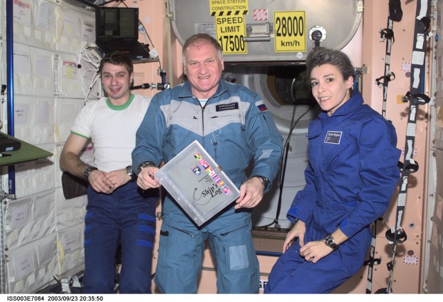 The Soyuz Taxi crewmembers, Flight Engineer Konstantin Kozeev (left), Commander Victor Afanasyev and French Flight Engineer Claudie Haignere add their names to the list of the International Space Station (ISS) visitors in the ship’s log in the Unity node. Afanasyev and Kozeev represent Rosaviakosmos, and Haignere represents ESA, carrying out a flight program for CNES, the French Space Agency, under a commercial contract with the Russian Aviation and Space Agency. This image was taken with a digital still camera.