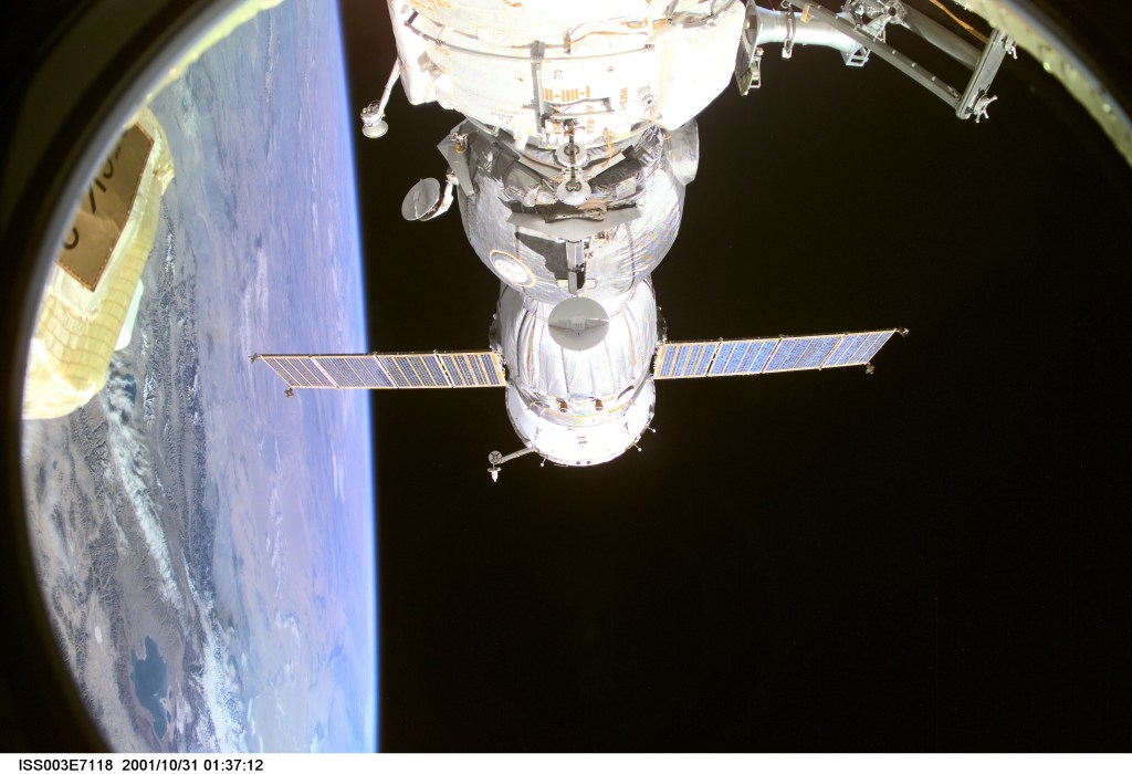 A Soyuz spacecraft, backdropped by Earth’s horizon and the blackness of space, is photographed prior to departure from the International Space Station (ISS), carrying the Soyuz taxi crew back to Earth, ending their eight-day stay on the station. The crewmembers are Commander Victor Afanasyev, Flight Engineer Konstantin Kozeev and French Flight Engineer Claudie Haignere. Afanasyev and Kozeev represent Rosaviakosmos, and Haignere represents ESA, carrying out a flight program for CNES, the French Space Agency, under a commercial contract with the Russian Aviation and Space Agency. This image was taken with a digital still camera.