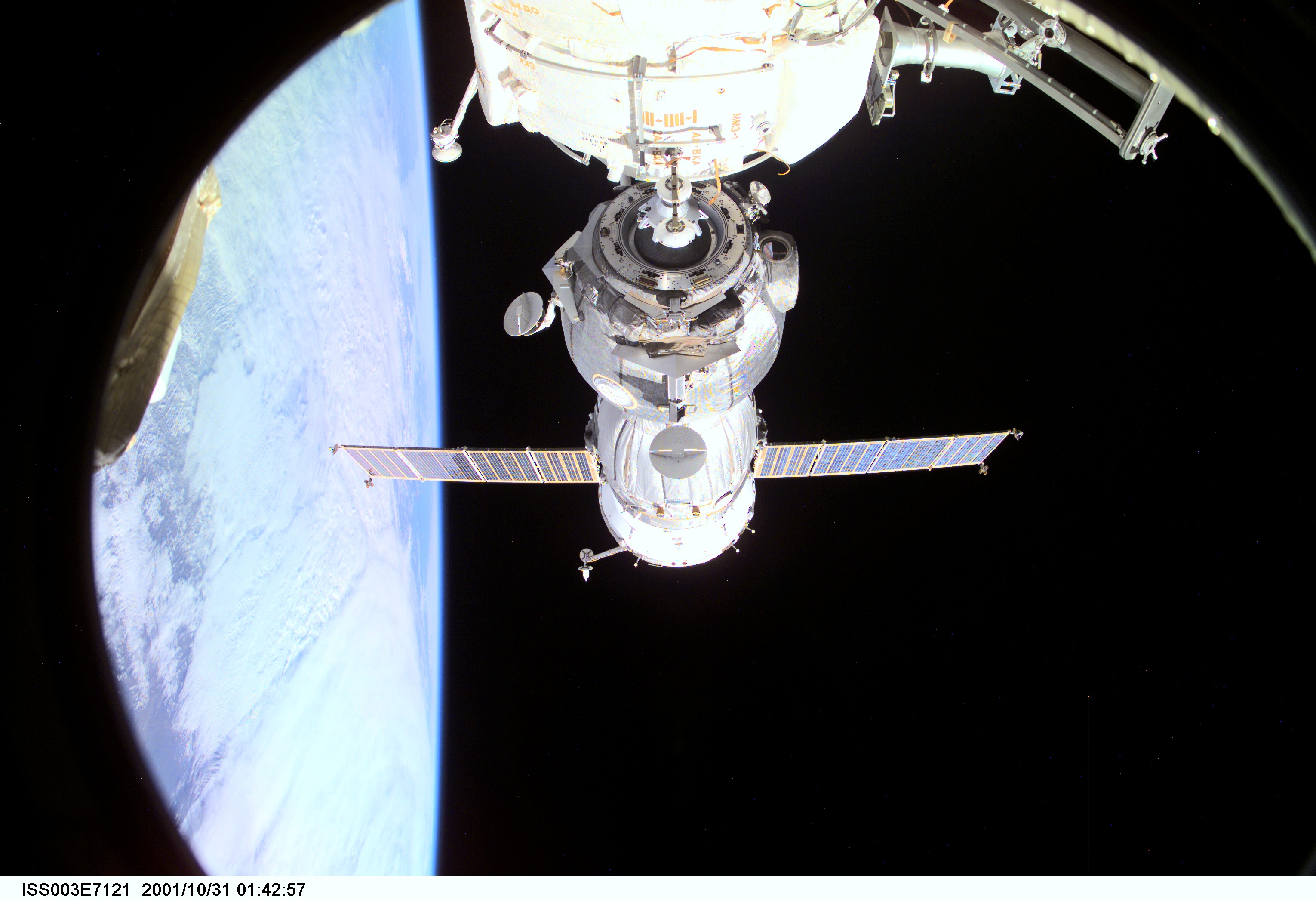 Backdropped by Earth’s horizon and the blackness of space, a Soyuz spacecraft undocks from the International Space Station (ISS) carrying the Soyuz taxi crew, Commander Victor Afanasyev, Flight Engineer Konstantin Kozeev and French Flight Engineer Claudie Haignere, ending their eight-day stay on the station. Afanasyev and Kozeev represent Rosaviakosmos, and Haignere represents ESA, carrying out a flight program for CNES, the French Space Agency, under a commercial contract with the Russian Aviation and Space Agency. This image was taken with a digital still camera.