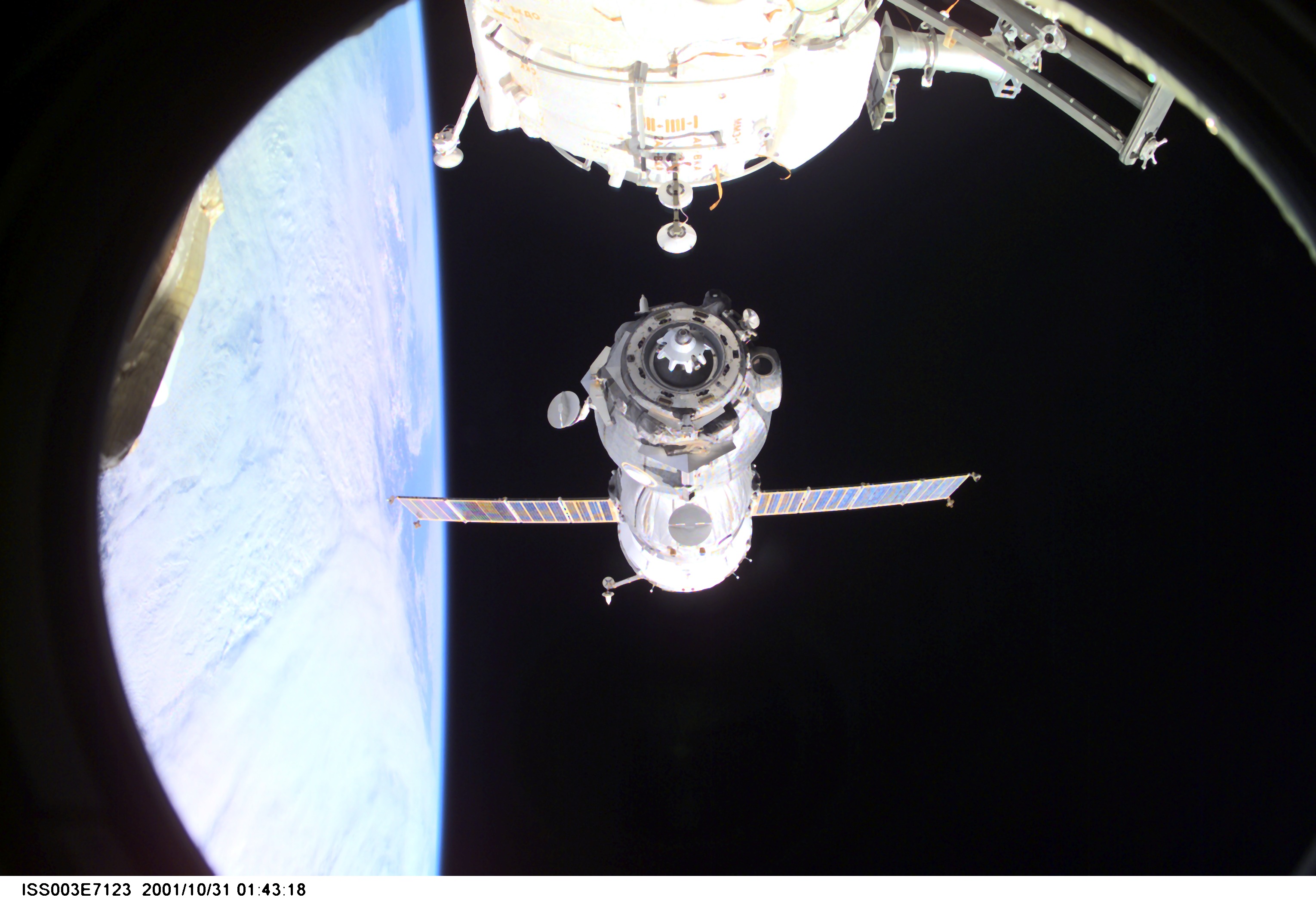 Backdropped by Earth’s horizon and the blackness of space, a Soyuz spacecraft undocks from the International Space Station (ISS) carrying the Soyuz taxi crew, Commander Victor Afanasyev, Flight Engineer Konstantin Kozeev and French Flight Engineer Claudie Haignere, ending their eight-day stay on the station. Afanasyev and Kozeev represent Rosaviakosmos, and Haignere represents ESA, carrying out a flight program for CNES, the French Space Agency, under a commercial contract with the Russian Aviation and Space Agency. This image was taken with a digital still camera.