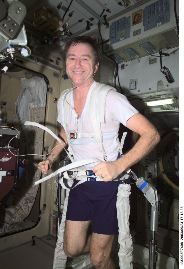 Astronaut Frank L. Culbertson, Jr., Expedition Three mission commander, exercises on a treadmill in the Zvezda Service Module on the International Space Station (ISS). This image was taken with a digital still camera.