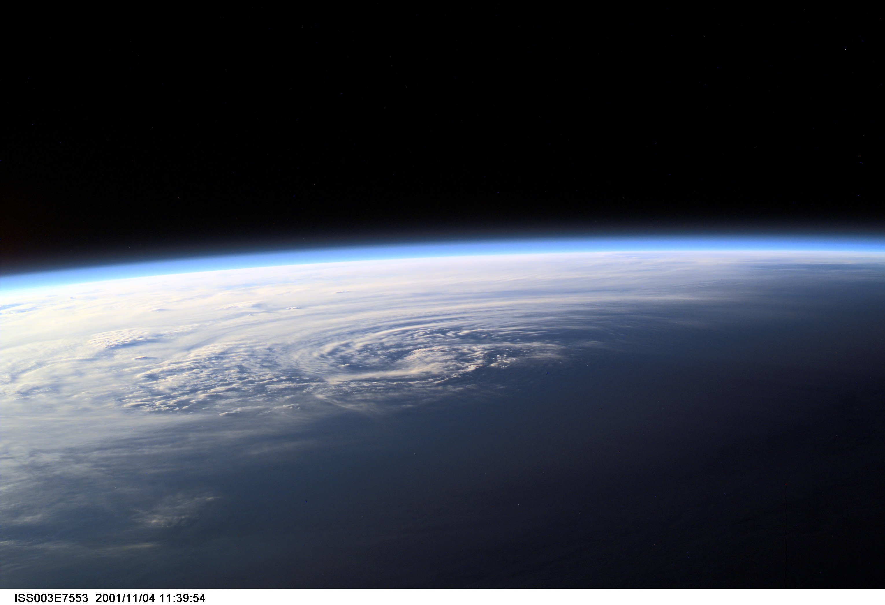 Pictured near Earth's horizon, Hurricane Michelle made landfall on Cuba on November 4, 2001, with sustained winds of 135 miles per hour. The most signficant impact was in the Matanzas province near Pinar del Rio. This scene was captured by one of the Expedition Three crew members aboard the International Space Station (ISS)using a digital still camera.