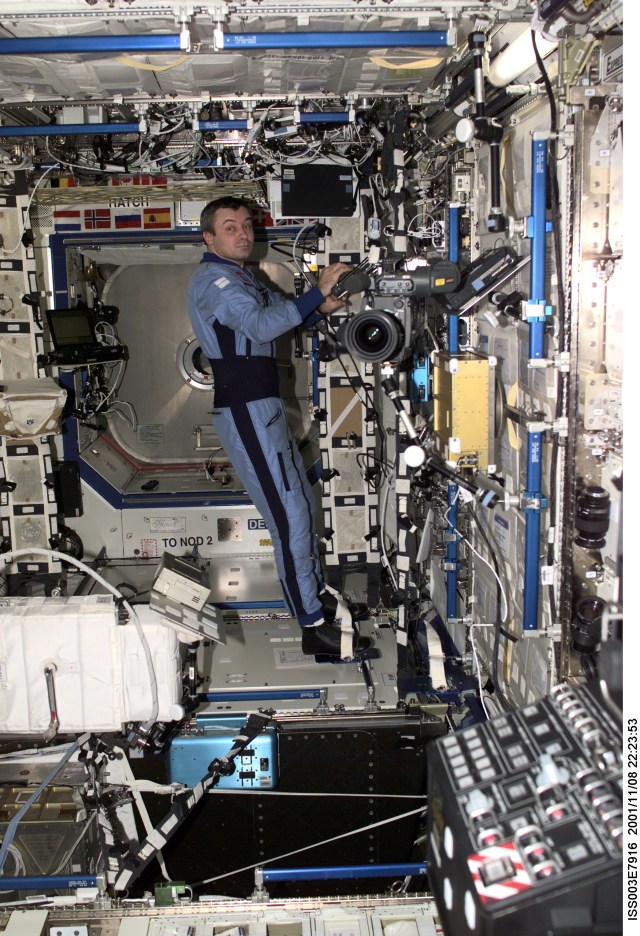 Cosmonaut Vladimir N. Dezhurov, Expedition Three flight engineer representing Rosaviakosmos, works in the Destiny laboratory on the International Space Station (ISS). This image was taken with a digital still camera.