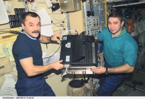 Cosmonaut Mikhail Tyurin (left), Expedition Three flight engineer, and Soyuz Taxi crewmember, Flight Engineer Konstantin Kozeev work in the Zvezda Service Module on the International Space Station. Tyurin and Kozeev represent Rosaviakosmos. This image was taken with a digital still camera.