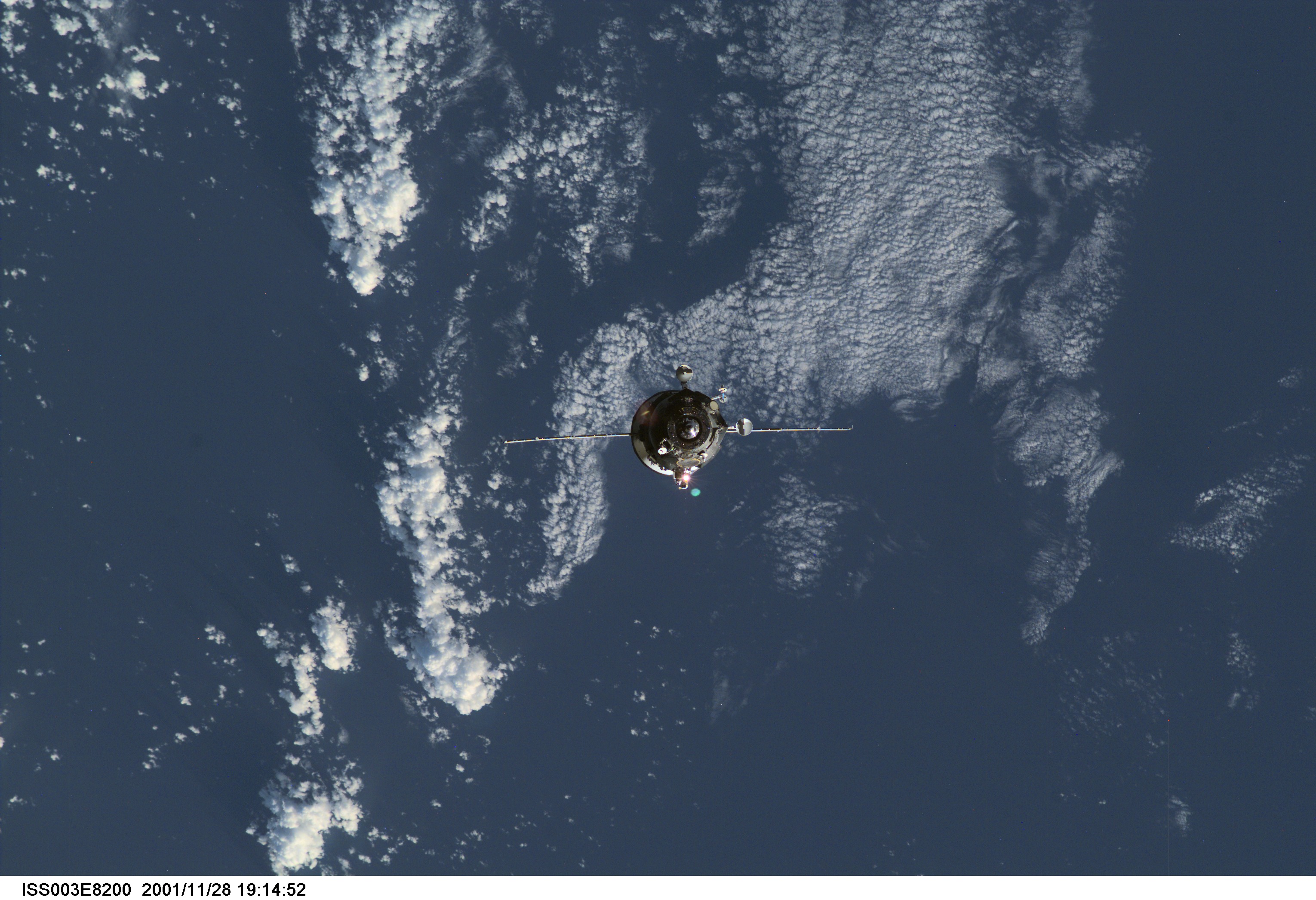 Backdropped by the blue and white Earth, an unpiloted Progress supply vehicle approaches the aft port of the Zvezda Service Module (out of frame) on the International Space Station (ISS), completing a two-day automated flight. The Progress 6 craft, which launched from the Baikonur Cosmodrome in Kazakhstan on Monday, November 26, 2001, carried more than a ton of food, fuel and equipment for the Expedition Four crew members.