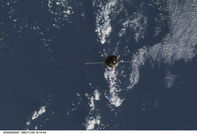 Backdropped by the blue and white Earth, an unpiloted Progress supply vehicle approaches the aft port of the Zvezda Service Module (out of frame) on the International Space Station (ISS), completing a two-day automated flight. The Progress 6 craft, which launched from the Baikonur Cosmodrome in Kazakhstan on Monday, November 26, 2001, carried more than a ton of food, fuel and equipment for the Expedition Four crew members.