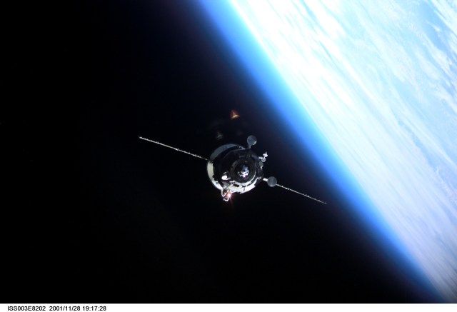 Backdropped by the blackness of space and the Earth’s horizon, an unpiloted Progress supply vehicle approaches the aft port of the Zvezda Service Module (out of frame) on the International Space Station (ISS), completing a two-day automated flight. The Progress 6 craft, which launched from the Baikonur Cosmodrome in Kazakhstan on Monday, November 26, 2001, carried more than a ton of food, fuel and equipment for the Expedition Four crew members.