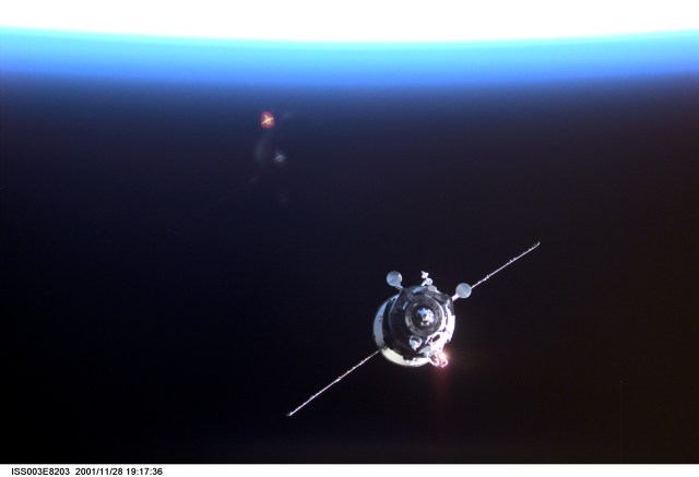 Backdropped by the blackness of space and the Earth’s horizon, an unpiloted Progress supply vehicle approaches the aft port of the Zvezda Service Module (out of frame) on the International Space Station (ISS), completing a two-day automated flight. The Progress 6 craft, which launched from the Baikonur Cosmodrome in Kazakhstan on Monday, November 26, 2001, carried more than a ton of food, fuel and equipment for the Expedition Four crew members.