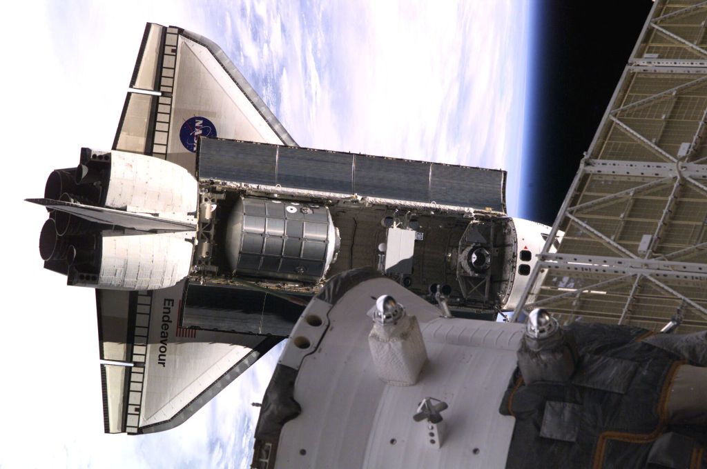 Backdropped against Earth's horizon, the Space Shuttle Endeavour, controlled by the flight crew of STS-108, rapidly approaches the International Space Station (ISS). Among other activities Endeavour's mission will include the change out of the station crews. The image was recorded with a digital still camera.