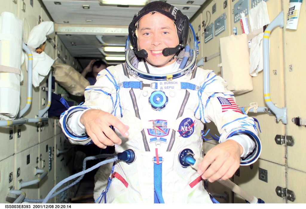 Astronaut Daniel W. Bursch, Expedition Four flight engineer, wearing a Russian Sokol suit, is photographed in the functional cargo block (FGB), or Zarya on the International Space Station (ISS). The image was taken with a digital still camera.