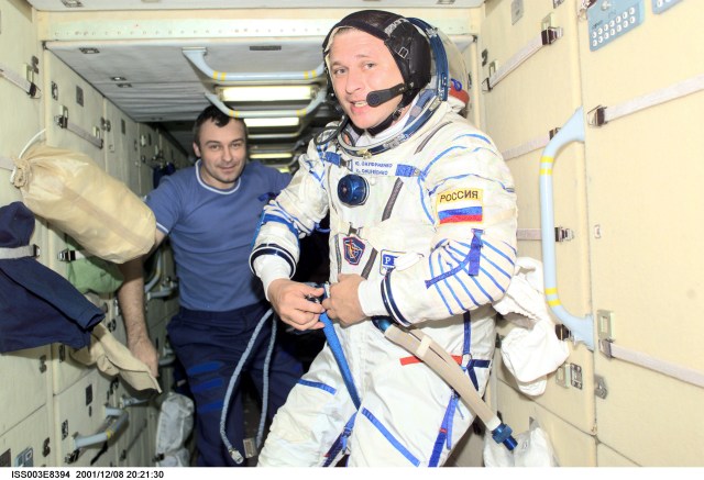 Cosmonauts Yuri I. Onufrienko, Expedition Four mission commander, wearing a Russian Sokol suit, and Vladimir N. Dezhurov, Expedition Three flight engineer, are photographed in the functional cargo block (FGB), or Zarya on the International Space Station (ISS). The image was taken with a digital still camera.